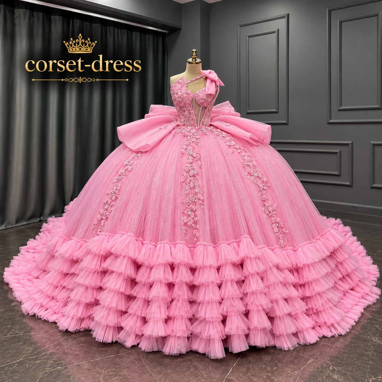 Opulent pink ball gown displayed in a showroom