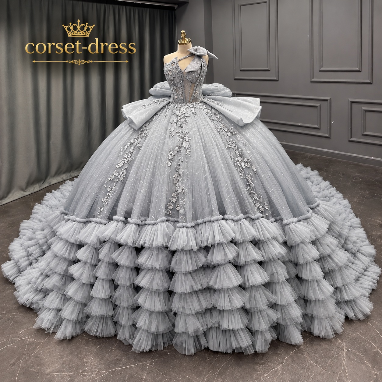 Silver gray ball gown displayed in a showroom